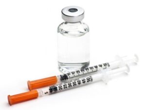 Vial of compounder semaglutide, the active ingredient of Ozempic accompanied by two insulin syringes for administration