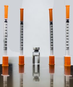 Vial of compounder tirzepatide, the active ingredient of Zepbound or Mounjaro, accompanied by four insulin syringes for administration