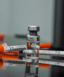 Vial of compounded semaglutide or tirzepatide, accompanied by two insulin syringes for administration